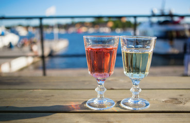 Two glasses of wine in an outdoor cafe
