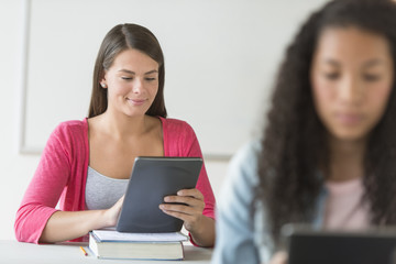 Beautiful Student Using Digital Tablet At Desk