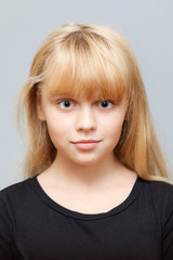 Closeup studio face portrait of little Caucasian girl