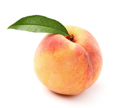 Ripe peach with leaf