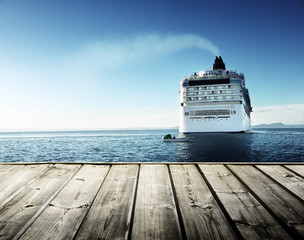Caribbean sea and cruise ship and wood pier