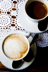 Coffee with milk and black coffee for breakfast