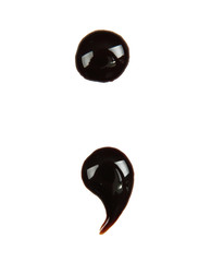 Punctuation mark  made from chocolate syrup, isolated on  white