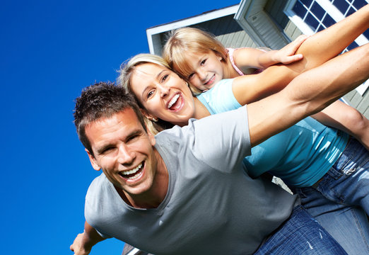 Happy family near the house