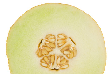 Yellow melon cut in half and isolated in white