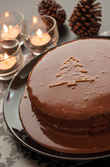 Sweet chocolate cakes setting for Christmas in dark tone.