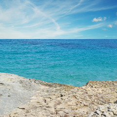 clouds over a rocky shore