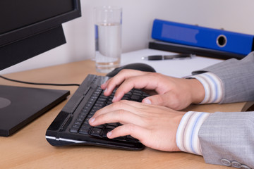business man hands typing on keyboard
