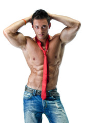 Fototapeta premium Handsome young muscle man naked, wearing only jeans and necktie