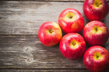 ripe apples on wooden table