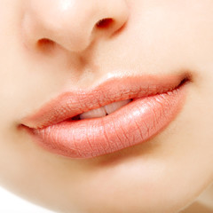 Beautiful smile of young fresh woman. Female lips closeup