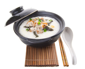 Traditional chinese pork porridge rice gruel served in claypot