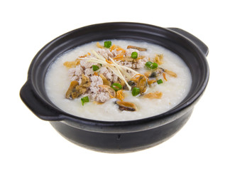Traditional chinese pork porridge rice gruel served in claypot