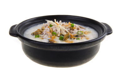 Traditional chinese pork porridge rice gruel served in claypot