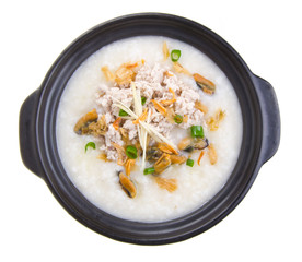 Traditional chinese pork porridge rice gruel served in claypot