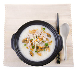 Traditional chinese pork porridge rice gruel served in claypot
