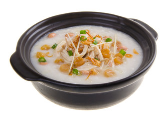 Traditional chinese scallop porridge rice gruel served in claypo