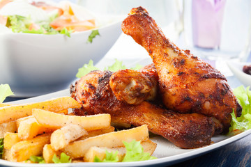 Chicken drumsticks with french fries