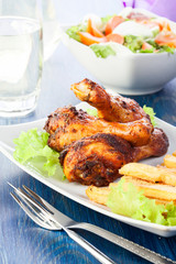 Chicken drumsticks with french fries