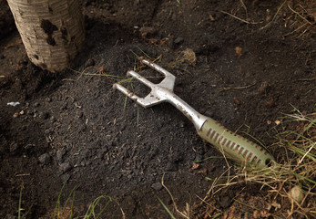 small gardening fork on soil