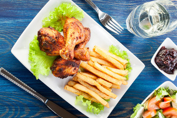 Chicken drumsticks with french fries