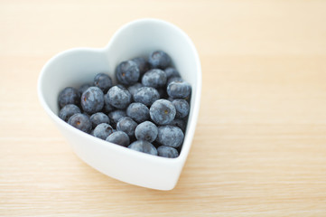 Blueberry in heart shape bowl