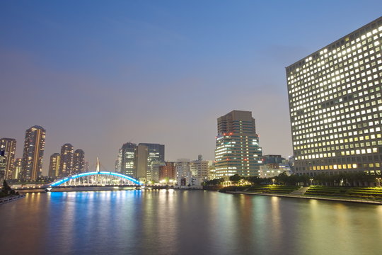 Tokyo skyline by night in modern Tsukishima district