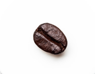 Close-up of coffee beans scattered. Background