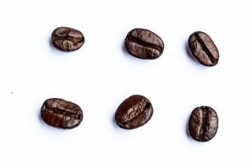 Close-up of coffee beans scattered. Background