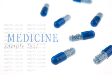 Blue pills isolated on white background