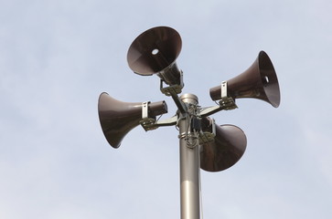 loudspeakers on a tall column