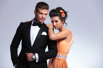 fashion couple looking into the camera