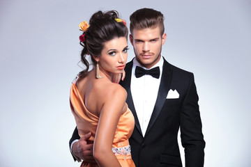 fashion couple with woman looking over shoulder