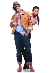 Fototapeta premium casual couple with woman standing behind man