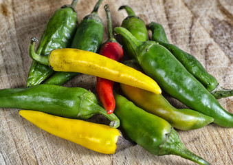 red hot chili pepper and other green and yellow peppers