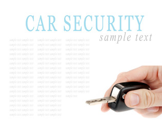 Hand holding car keys isolated on white background