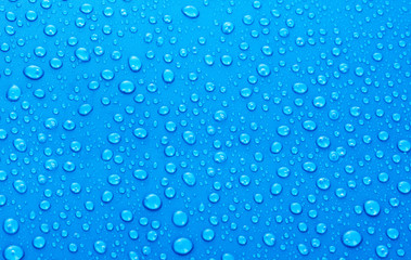 Naklejka na ściany i meble Beautiful blue water drops background