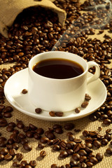 Cup of coffee and coffee beans