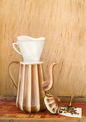 Vintage enamel coffee pot, coffee filter amd coffee beans