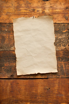 old blank paper nailed to a plank door