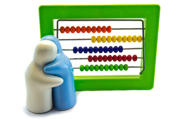 Bright  toy abacus and blue and white hug sculpture ,on white
