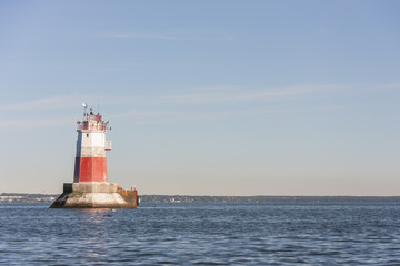Fototapeta na wymiar Big marine sign or lighthouse in sea