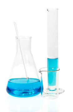 Laboratory glassware with blue liquid isolated on white