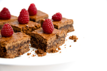 Cake with raspberries on a white background
