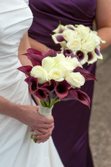 bride and bridesmaid with wedding bouquets