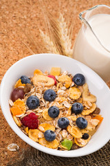 Muesli with pieces of fruit blueberries and raspberries