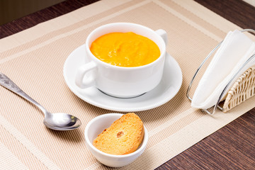 Sweet Pumpkin porridge in white bowl at the table