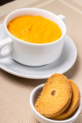 Sweet Pumpkin porridge in white bowl at the table