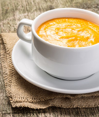 Sweet pumpkin porridge at old wood plank