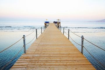 Fototapeta premium wooden platform beside sea